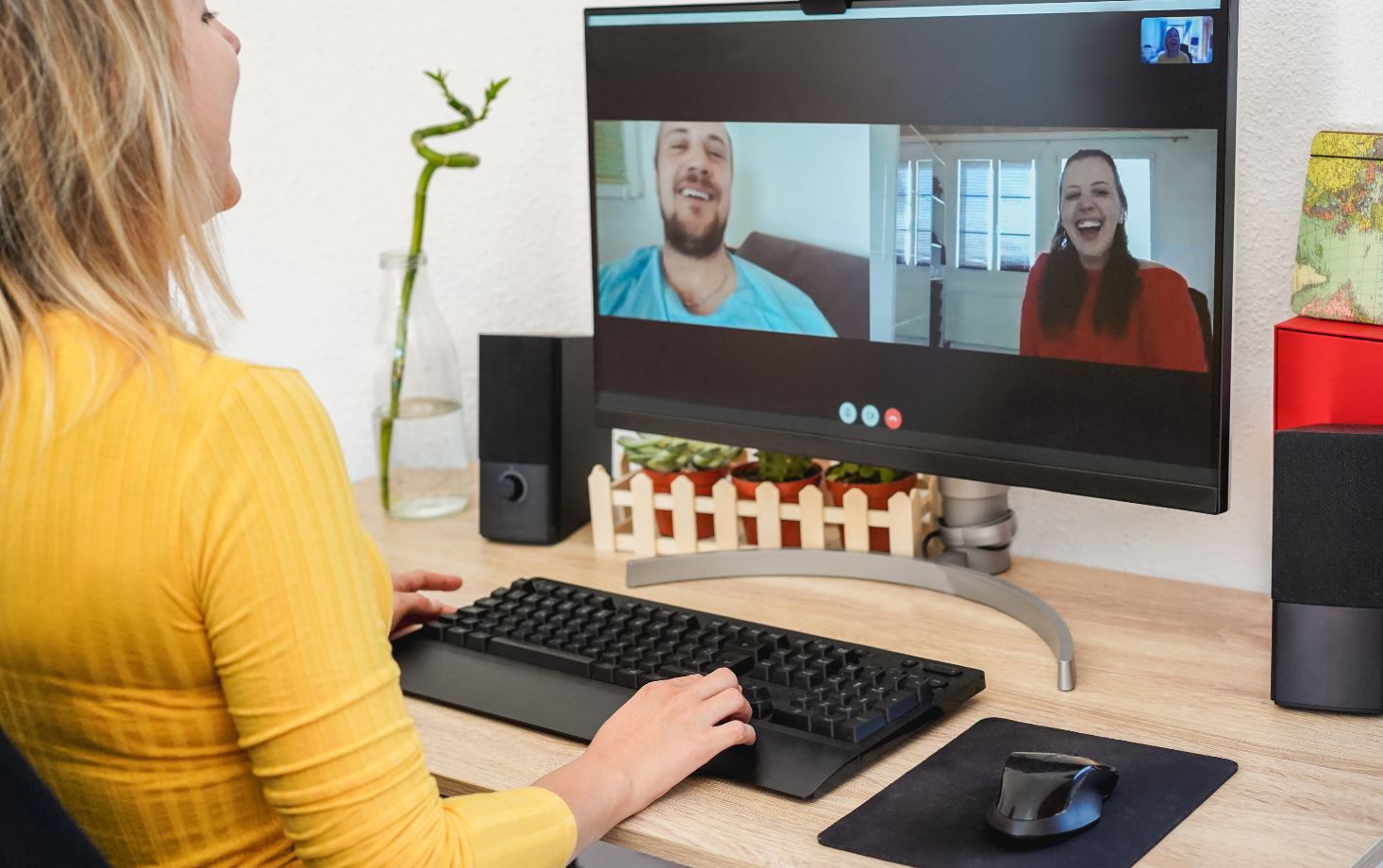Image of an online conference with 3 people.